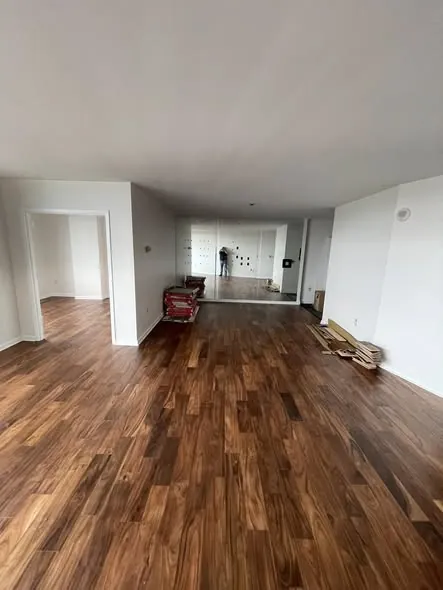 Wide open living area with freshly installed acacia hardwood flooring